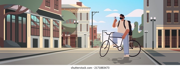 young man with bike using smartphone sportsman riding bicycle workout healthy lifestyle digital addiction concept