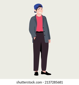 junger Mann mit blauem Baseballdeckel, rotem Hemd, grauer Jacke und brauner Hose