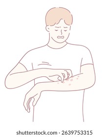 A young man can be seen appearing deeply distressed, scratching his arm, which shows clear signs of skin irritation