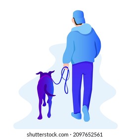 A young man in a cap went for a walk with a dog