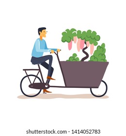 Young man carrying plants on Dutch cargo bike. Vector flat illustration.