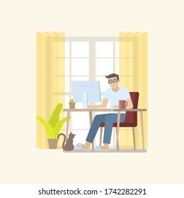Young man in casual clothing working at home in daytime with desktop computer on table in a cozy room interior with door, curtain, plant, coffee mug and cat in flat cartoon style