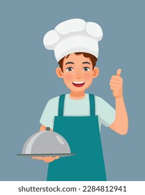 Young man in chef hat and apron holding a tray showing thumb up