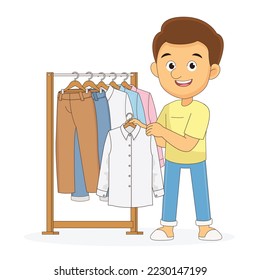 Young man chooses clothes on hanger on shopping