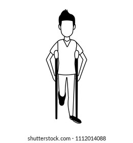 Young man with crutches in black and white