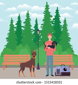 young man with cute dogs mascots in the park