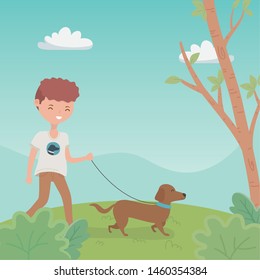 young man with cute little dog mascot in the field