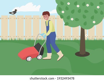 Young man cutting grass in his garden with grass cutter. lawnmower