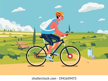 young man cycling in the suburban with beautiful green landscape in the background. used for poster, banner and other