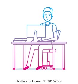 young man at desk with computer