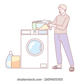 A young man diligently loads vibrant and colorful laundry into a washing machine, with detergent nearby for use