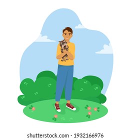 Young man with a dog in his arms, happy pet owner, yorkshire terrier, vector illustration in flat style.
