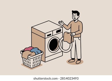 Young man doing household chores standing next to a washing machine with a laundry basket full of colorful clothing items.