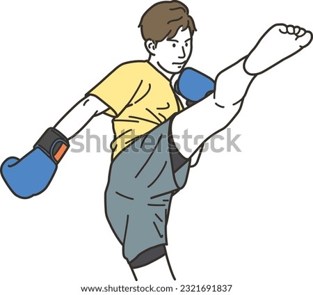 Young man doing martial arts kick
