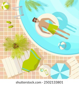 Young man dressed in a swimsuit and sunglasses takes a sunbathe in a swimming pool surrounded by tropical plants on square backdrop