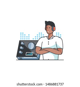 young man with earphones and audio console