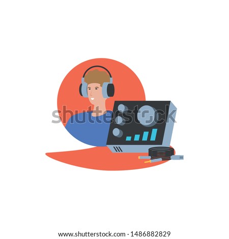 young man with earphones and audio console