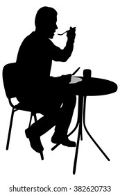 young man eating lunch in a cafe