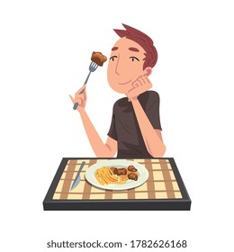 Young Man Eating Meat with French Fries, Cheerful Guy Sitting at Table with Checkered Tablecloth Cartoon Vector Illustration