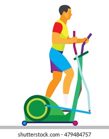 young man is engaged in the cross trainer in a hall