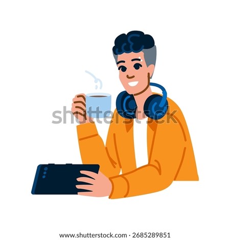 Young man enjoying a cup of hot coffee while holding a tablet, wearing headphones around his neck, and working or studying comfortably from home in a relaxed atmosphere