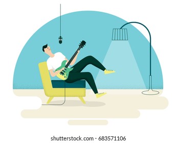 Young man enjoying singing and playing guitar in living room