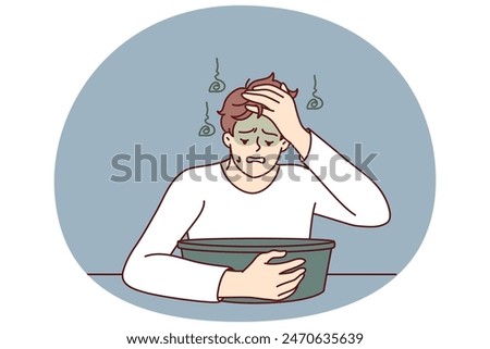 Young man feels nausea sitting near basin experiencing problem after being poisoned or suffering from hangover. Guy with symptoms of nausea and vomiting after alcohol party and unhealthy lifestyle