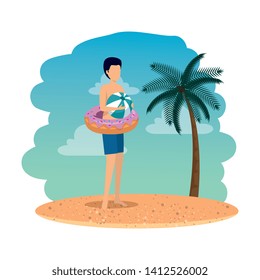young man with float donut and balloon plastic on the beach