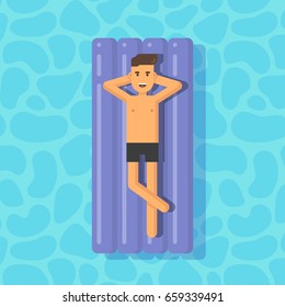 Young man floating on a mattress in a swimming pool