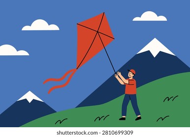 Young man flying a bright red kite in a scenic mountain landscape with snow capped peaks and white clouds under a clear blue sky during summer.