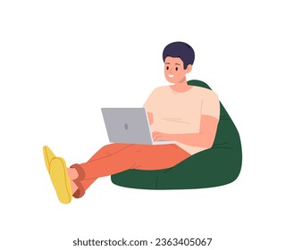 Young man freelancer or student sitting on soft bean bag with laptop computer isolated on white