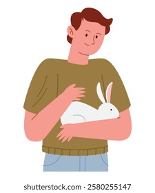 Young man gently carrying his fluffy pet rabbit with affection