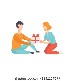 Young man giving gift box decorated with red ribbon bow to girl sitting on the floor, people celebrating the holiday vector Illustration on a white background