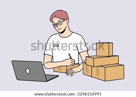 Young man in glasses look at laptop sign parcels at post. Smiling male worker write address and receiver on package in postal office. Vector illustration. 