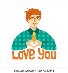 A young man in a green plaid shirt and red hair, folded his hands in his heart. the inscription I love you. Portrait of a smiling and winking man.