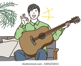 A young man with a guitar doing an OK pose
