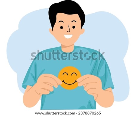 young man hand hold paper cut smiling face emoticon symbol
