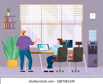 Young man in hat, casual clothes, back view, stands and talks with girl sits at desk working on monoblock. Office space. Water cooler, office furniture, lush pot plant, panoramic window with city view
