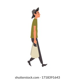 Joven caminando con una bolsa de compras, un hombre comprando en una ilustración vectorial del mercado