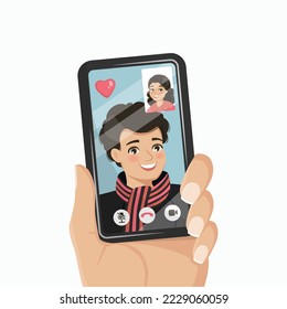 Un joven tiene una videollamada con su novia en un smartphone