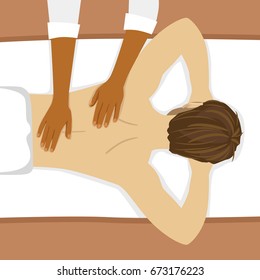 Young man having back massage in spa salon. Top view