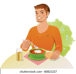 Young man is having lunch outdoors