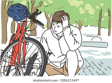 A young man having trouble with his bicycle
