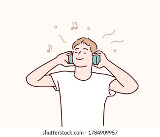 Young man with headphones listening to music. Hand drawn style vector design illustration.