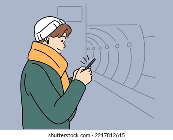 Young man in headphones use cellphone waiting for metro. Guy with smartphone in subway. Public transportation. Vector illustration. 