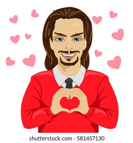 young man heartthrob making heart shape with his hands on saint valentine day