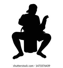 Young man with his fighting chicken silhouette vector