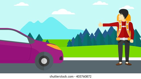 Young man hitchhiking.