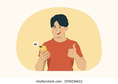 Young man hold mobile phone chat in social network show thumb up gesture concept