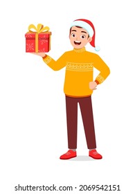 young man holding box present in christmas